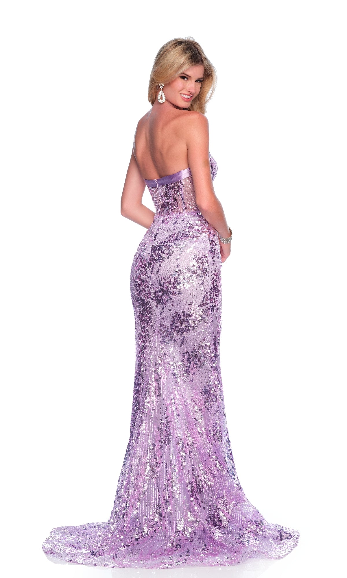 A woman with long blonde hair and silver earrings poses facing away, glancing over her shoulder in the strapless, sequined Long Lilac Prom Dress: Dave & Johnny 11944.